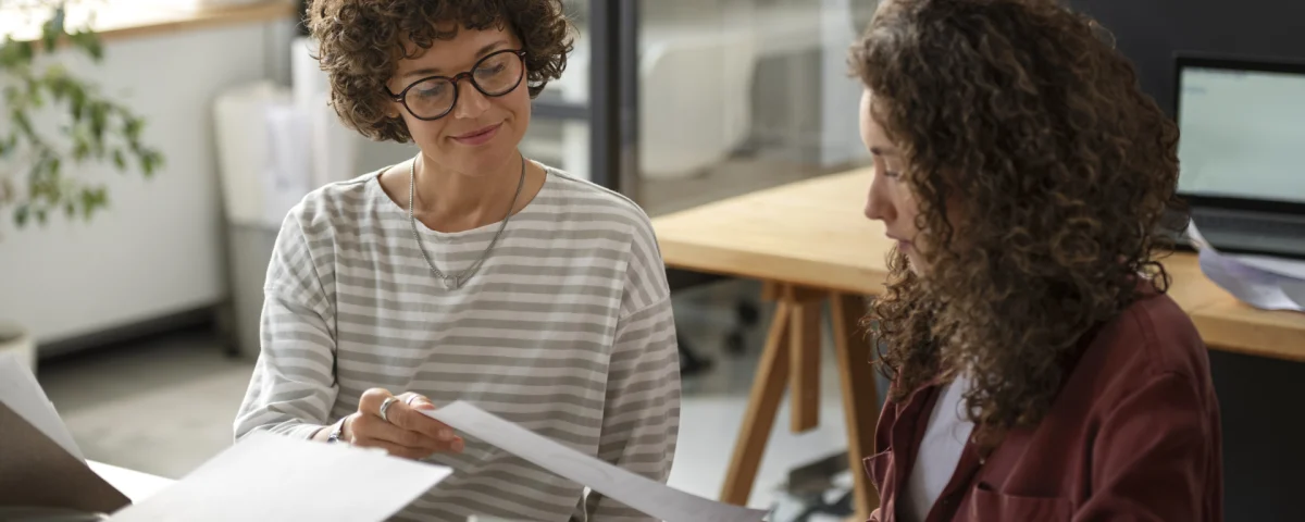 Professional lady mentoring younger colleague