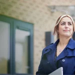 Young professional woman outside an office building